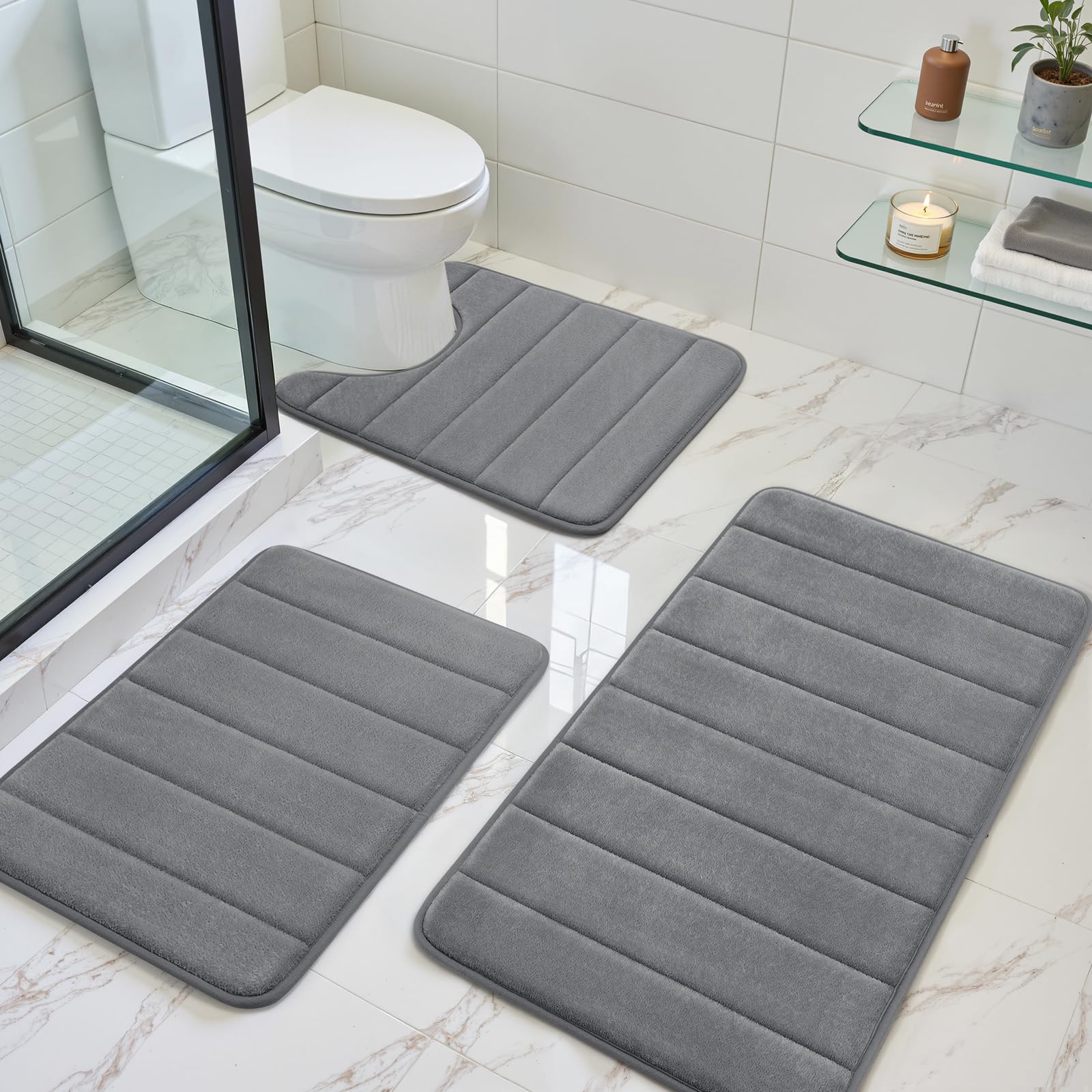 BYSURE dark grey memory foam bath mat 32x20 with anti-slip backing for secure footing.