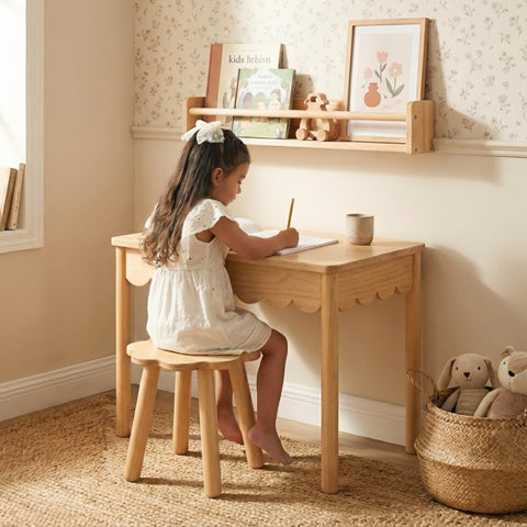 CAALMA & Co scalloped-edge table adds timeless style to playroom décor.