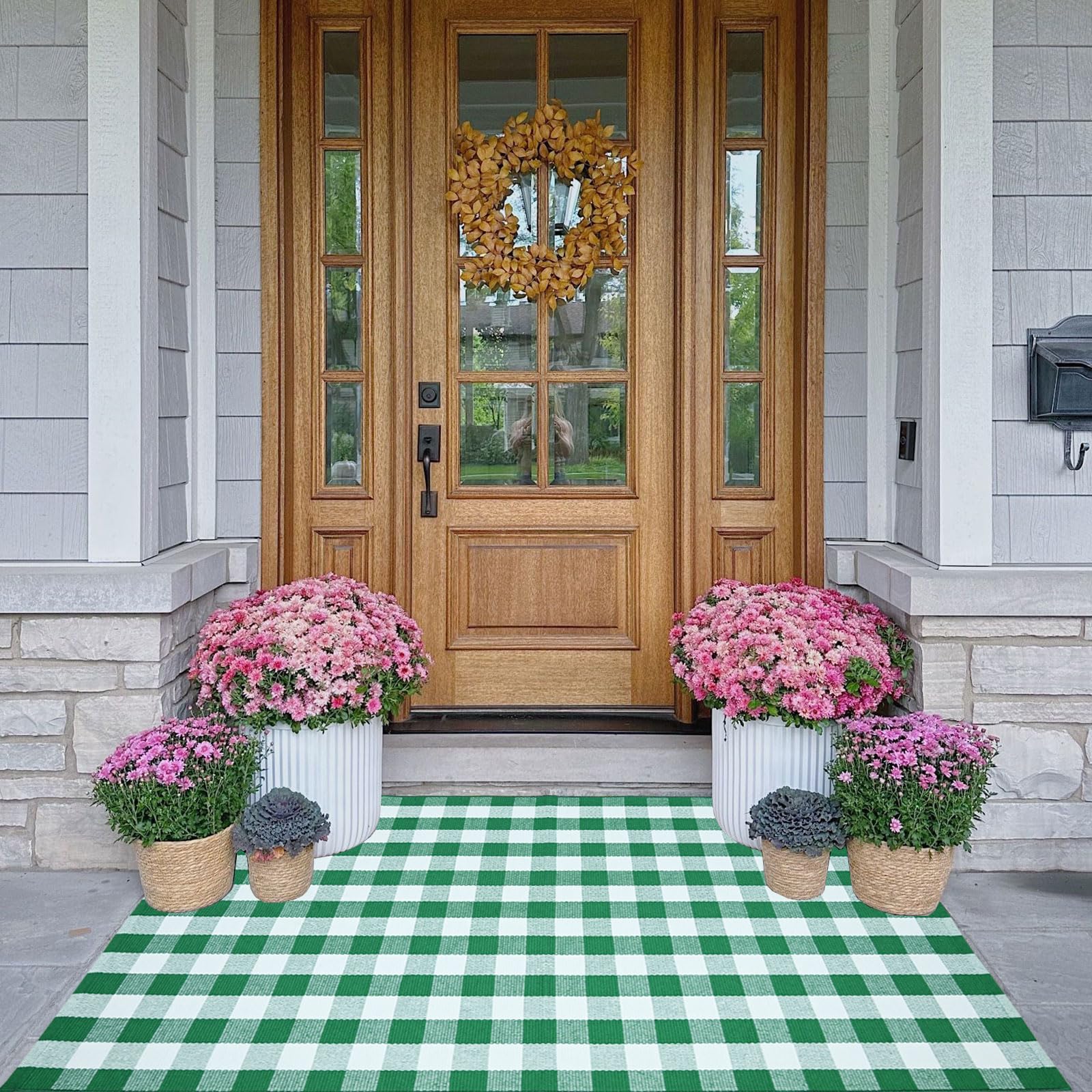 CAINANEL Buffalo Plaid Outdoor Rug front porch layered with a welcome mat for style.