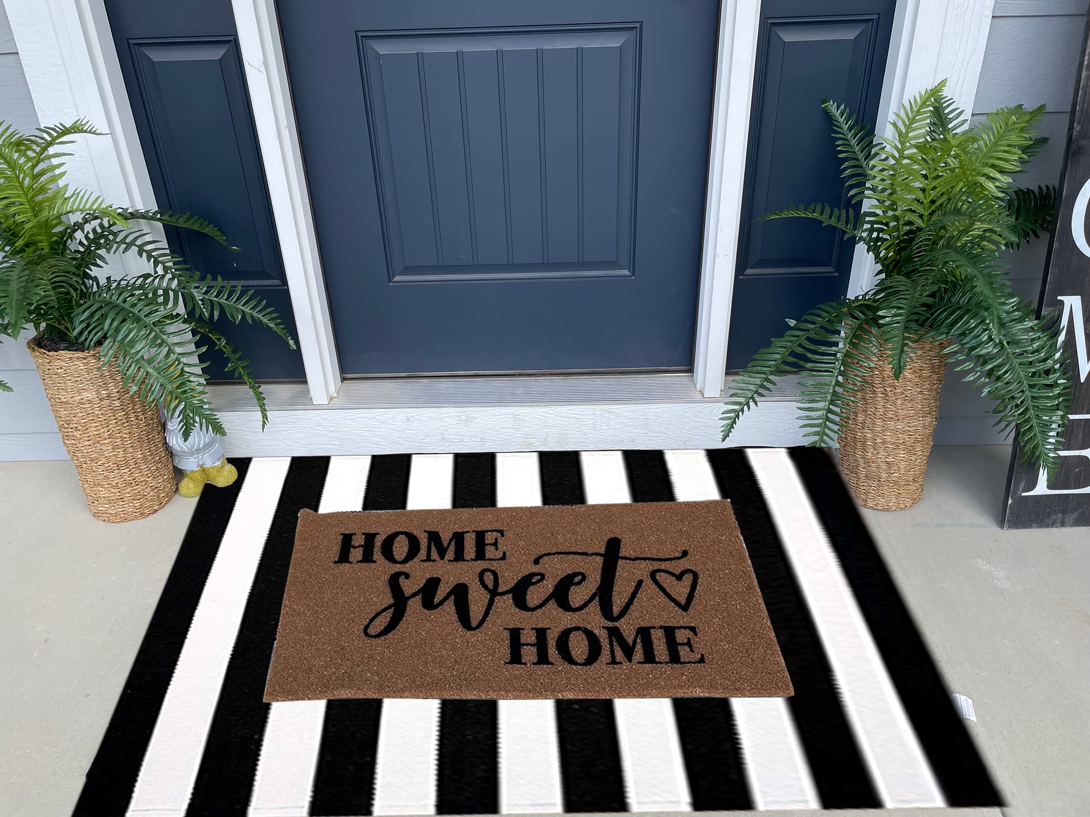CAINANEL front door striped rug enhances entryway curb appeal.