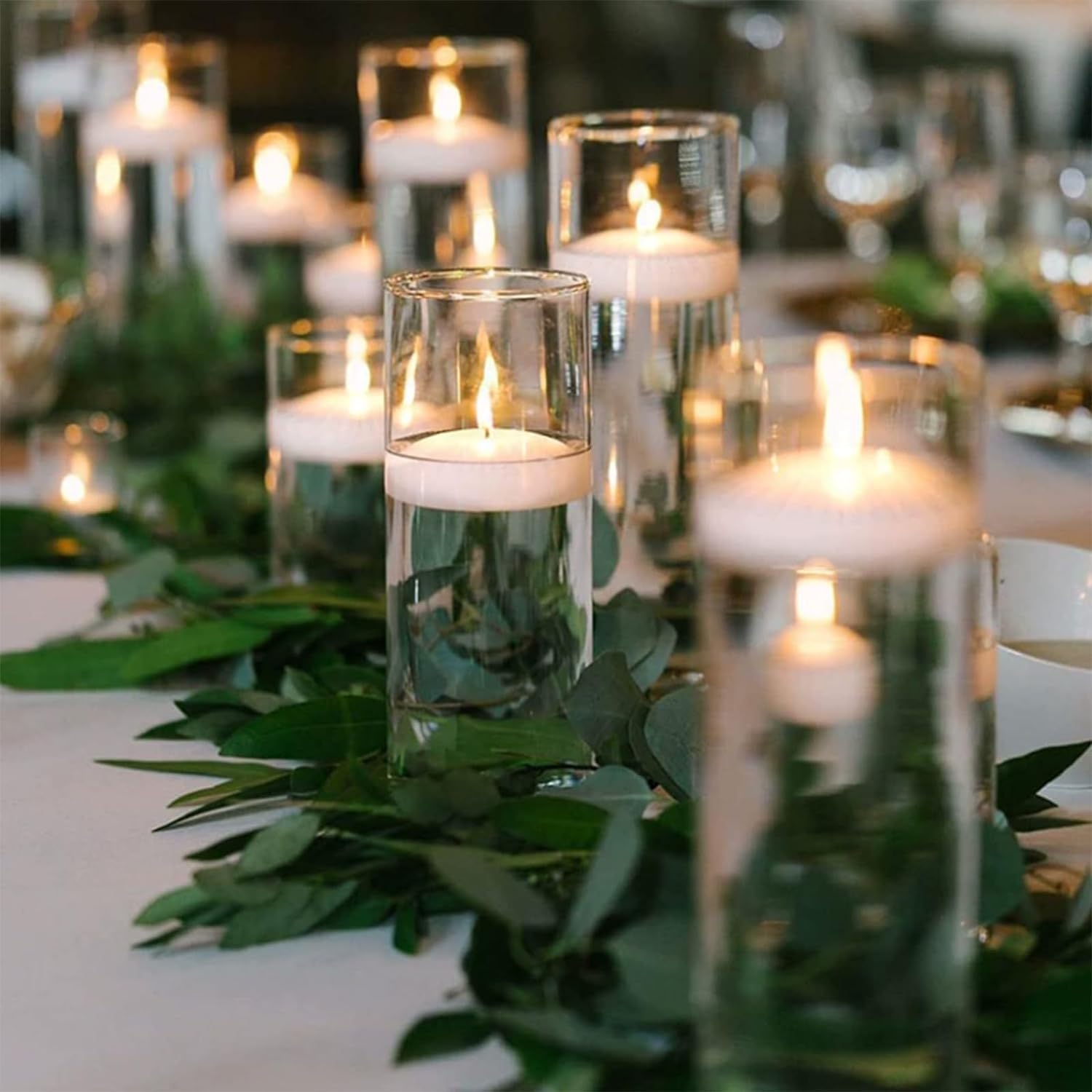 CAKETYCG 3-inch white floating candles ideal for elegant tabletop displays.
