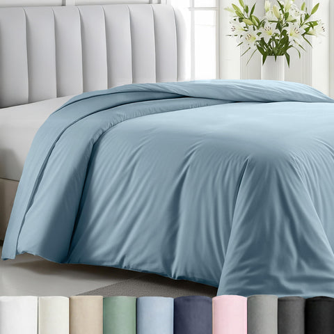 California Design Den duvet cover in sky blue on a twin bed for a serene look.