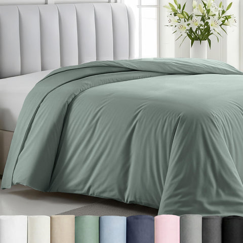 California Design Den sage green duvet cover close-up stitching showcases durable craftsmanship.
