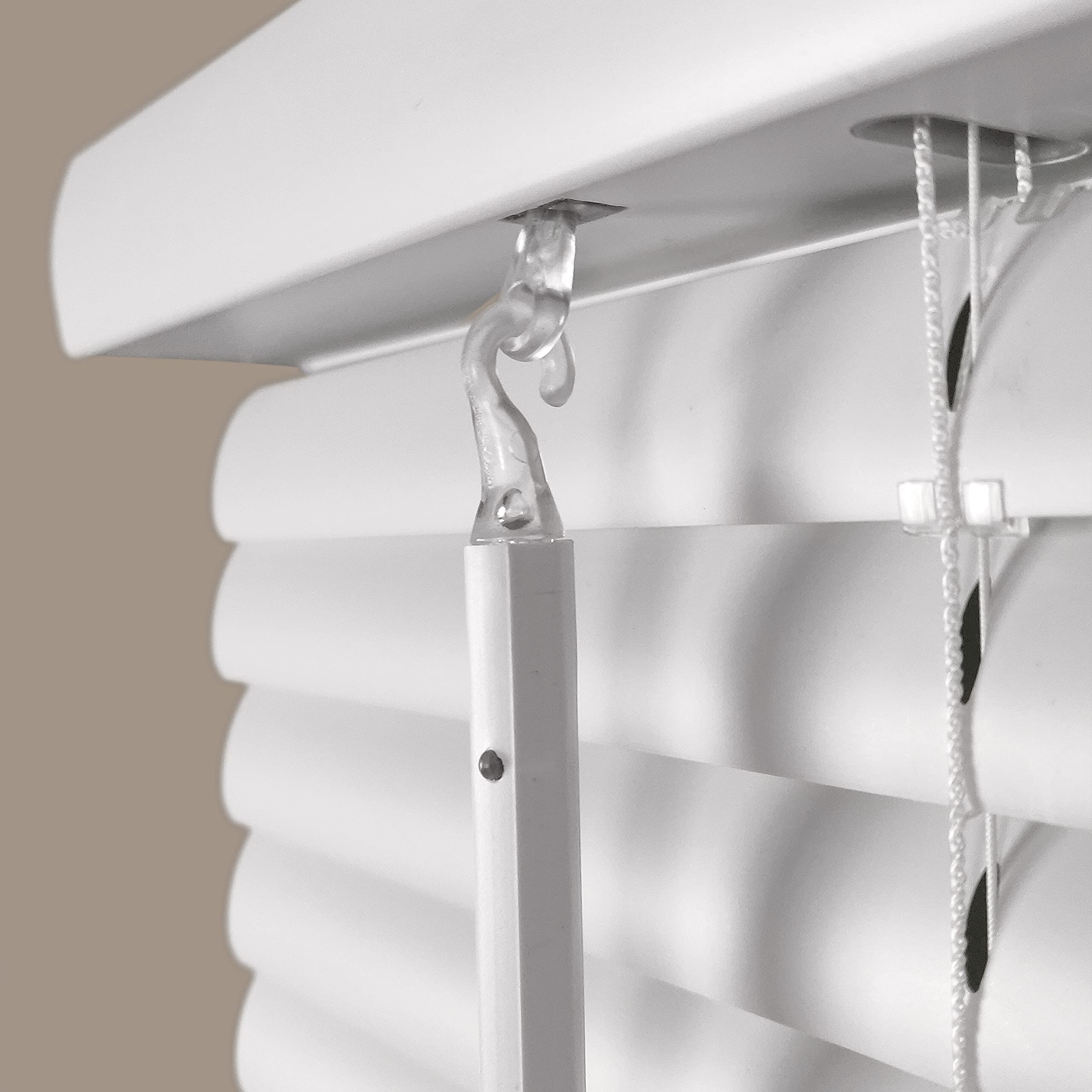 Calyx Interiors cordless white 1in mini blind installed in a kitchen for moisture-prone spaces.