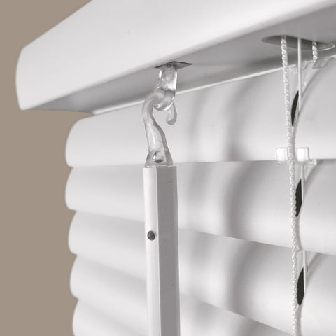 Calyx Interiors cordless white 1in mini blind installed in a kitchen for moisture-prone spaces.