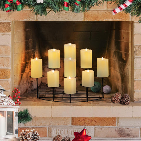 Candeldo Candelabra on a mantle showing nine heights and warm glow.