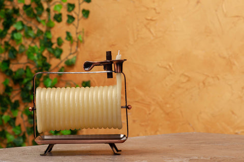 Candle by the Hour copper-tone stand supporting a stylish, safe candle display.