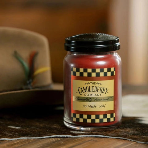 Candleberry amber glass jar glows warmly, enhancing evening ambiance.