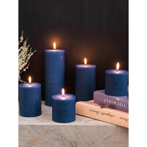 CANDWAX dining tabletop display with navy pillar candles enhances settings.