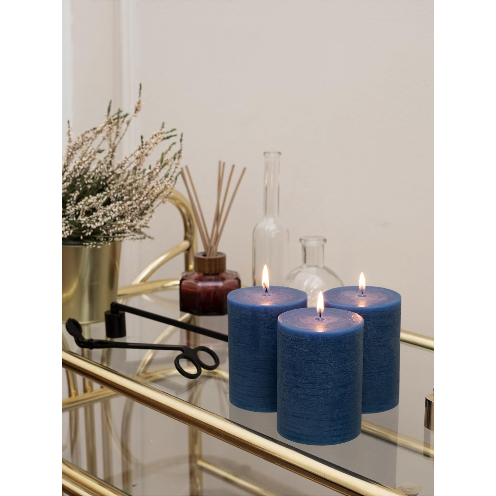 CANDWAX living room decor navy pillar candles create warm ambience.