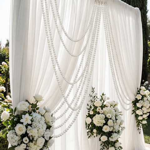 Two-pack pearl garland set enables layered decor options.