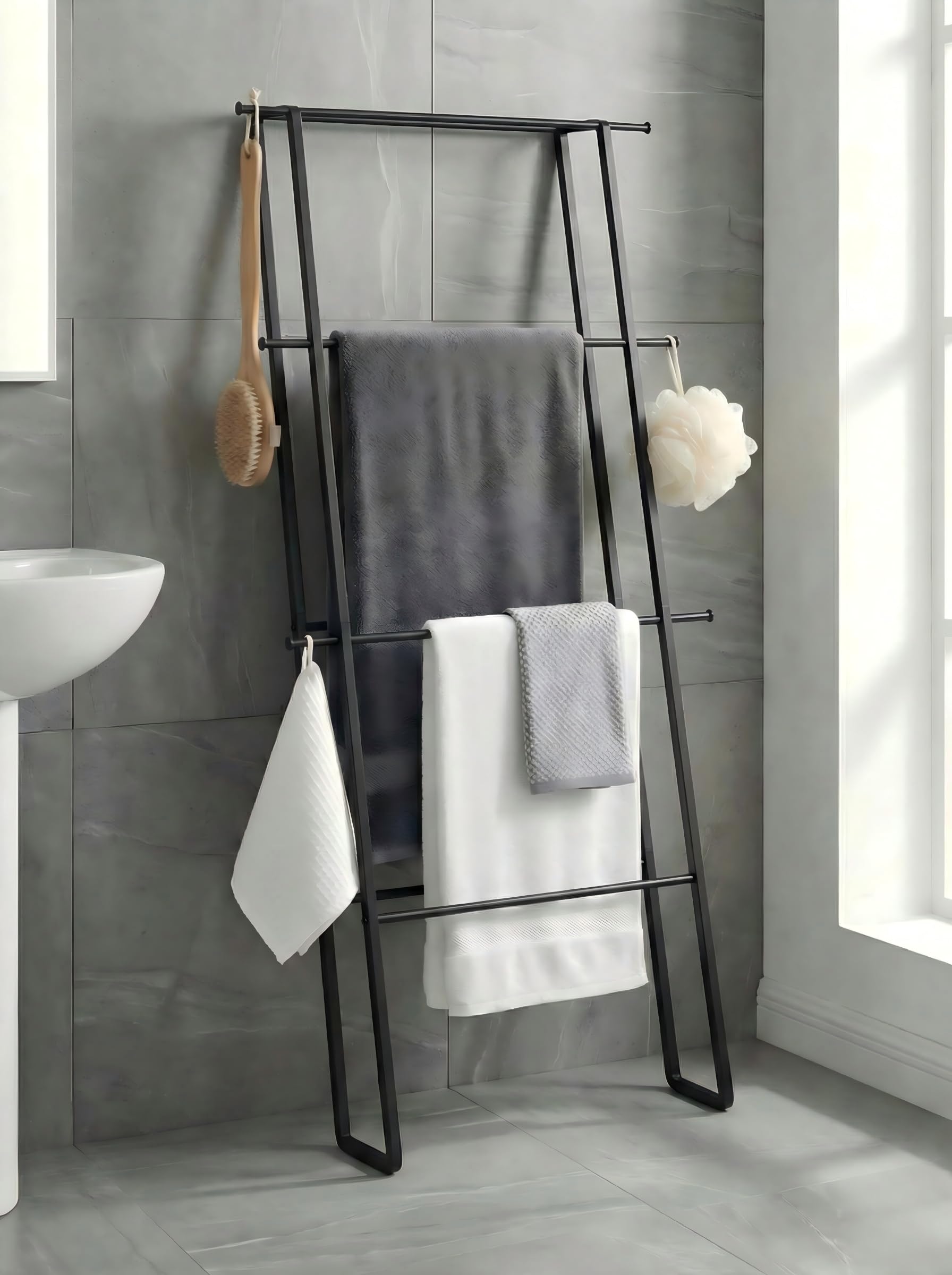 CANYAVE metal leaning ladder towel rack assembled against wall saves space for towels.