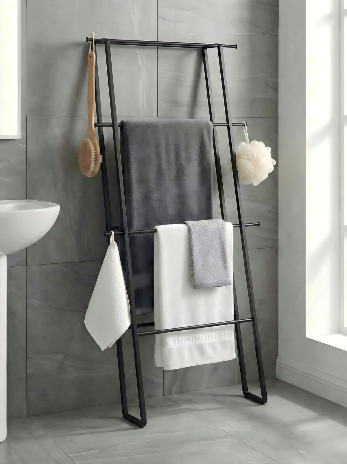 CANYAVE metal leaning ladder towel rack assembled against wall saves space for towels.