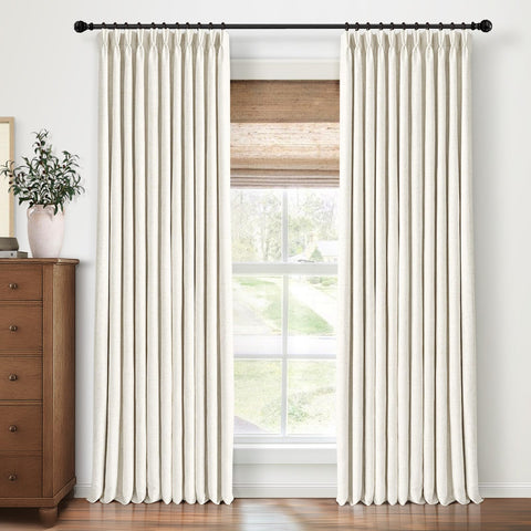 CAPALOCA natural linen blackout pinch-pleated curtains offer a luxe bedroom look