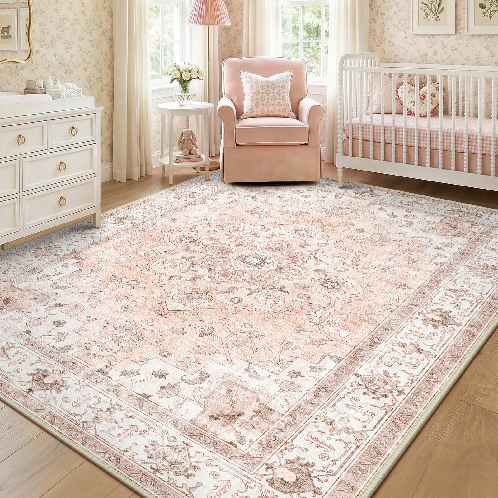 CAPALOCA 8x10 pink nursery rug with faded floral print enhances kid-friendly room decor.