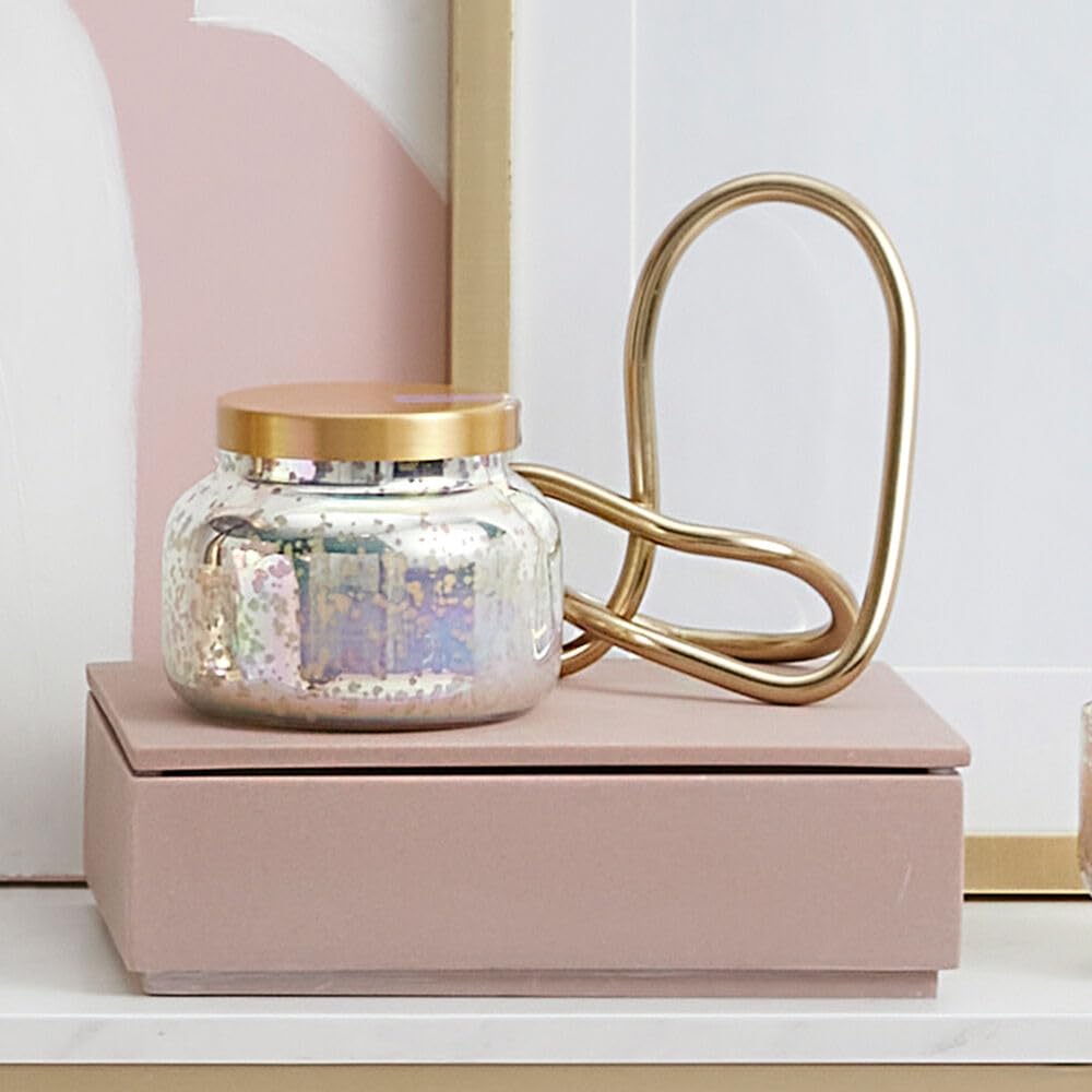 Capri Blue decorative candle on a stylish living room shelf.