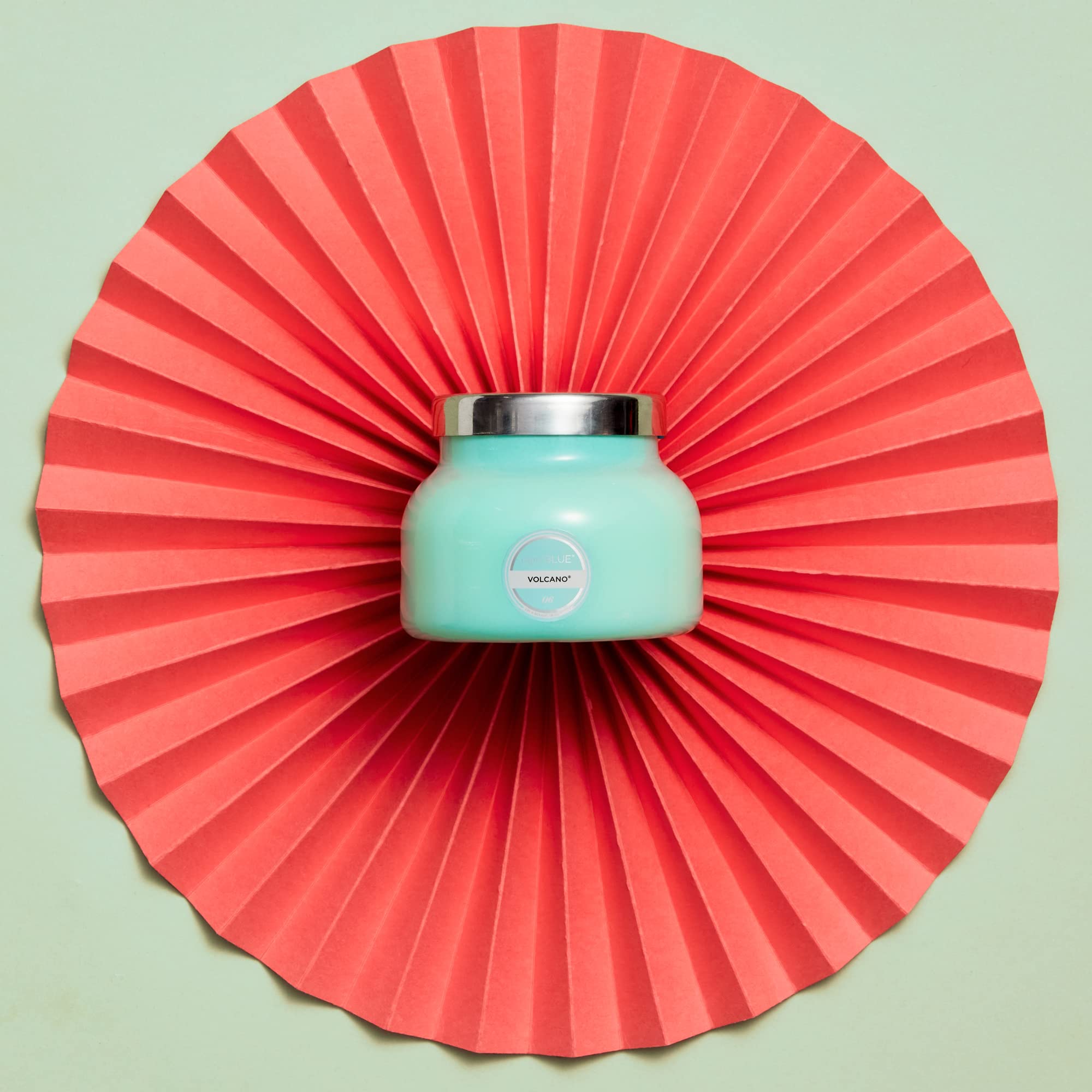 Close-up of Capri Blue Volcano Aqua glass jar showing bold color and premium packaging.
