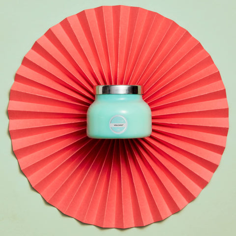 Close-up of Capri Blue Volcano Aqua glass jar showing bold color and premium packaging.