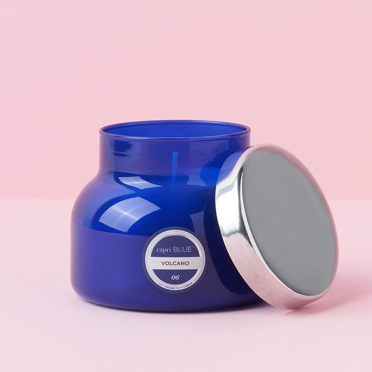 Capri Blue Volcano blue glass candle enhances any decor with iconic style.