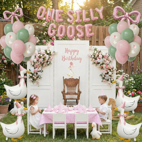 Carnira pink birthday hats provide quick photo-ready accessories for the centerpiece