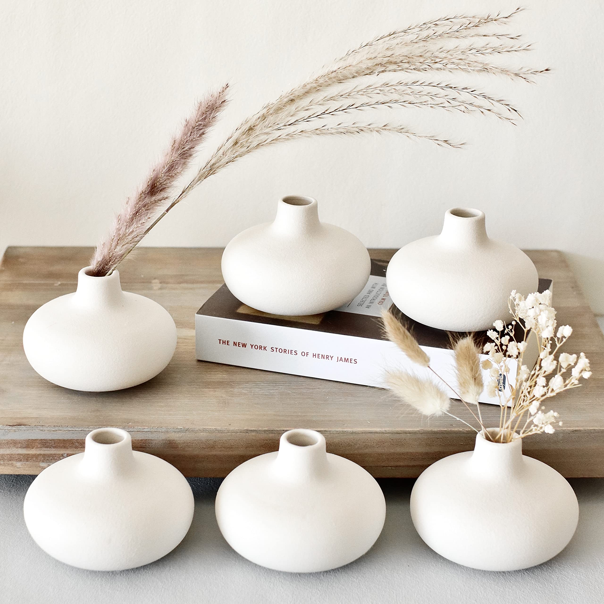 Carrot's Den Nordic donut bud vase with a single stem adds minimalist charm to any shelf.