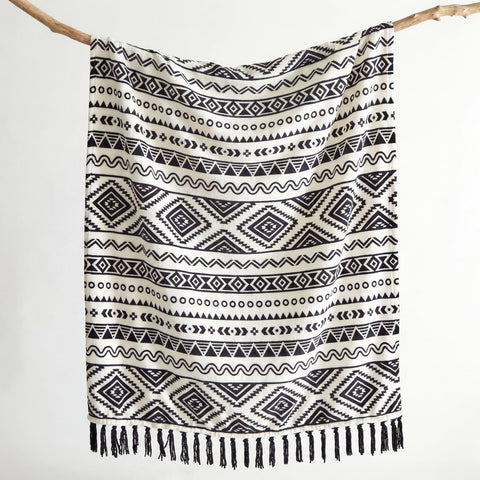 CASAAGUSTO farmhouse aztec pattern blanket draped for cozy living room decor.