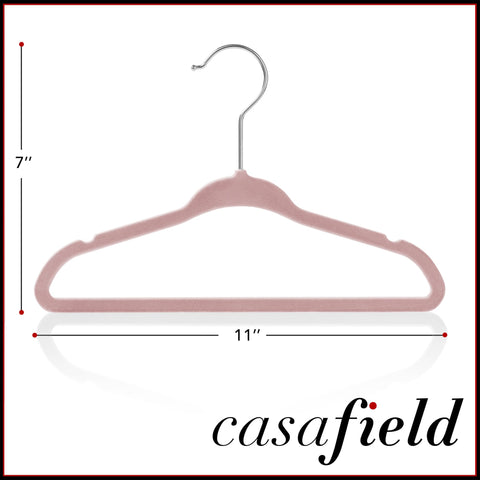Casafield light pink velvet hangers in closet for a coordinated look.