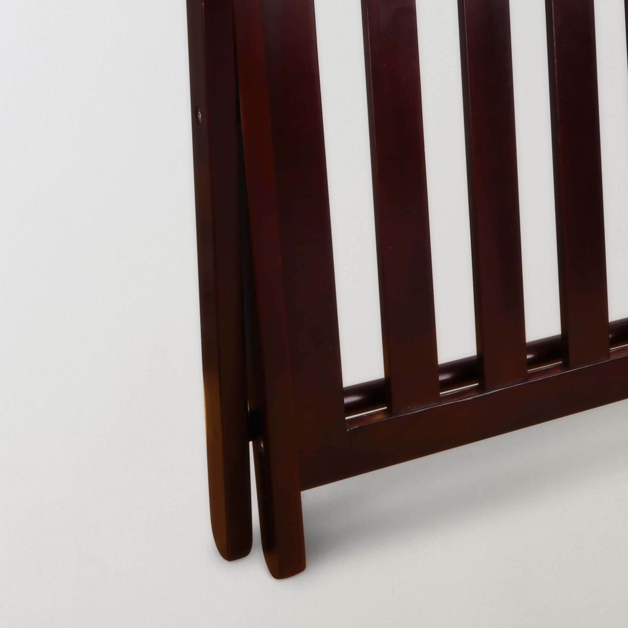Casual Home luggage rack folds for easy movement and discreet storage.