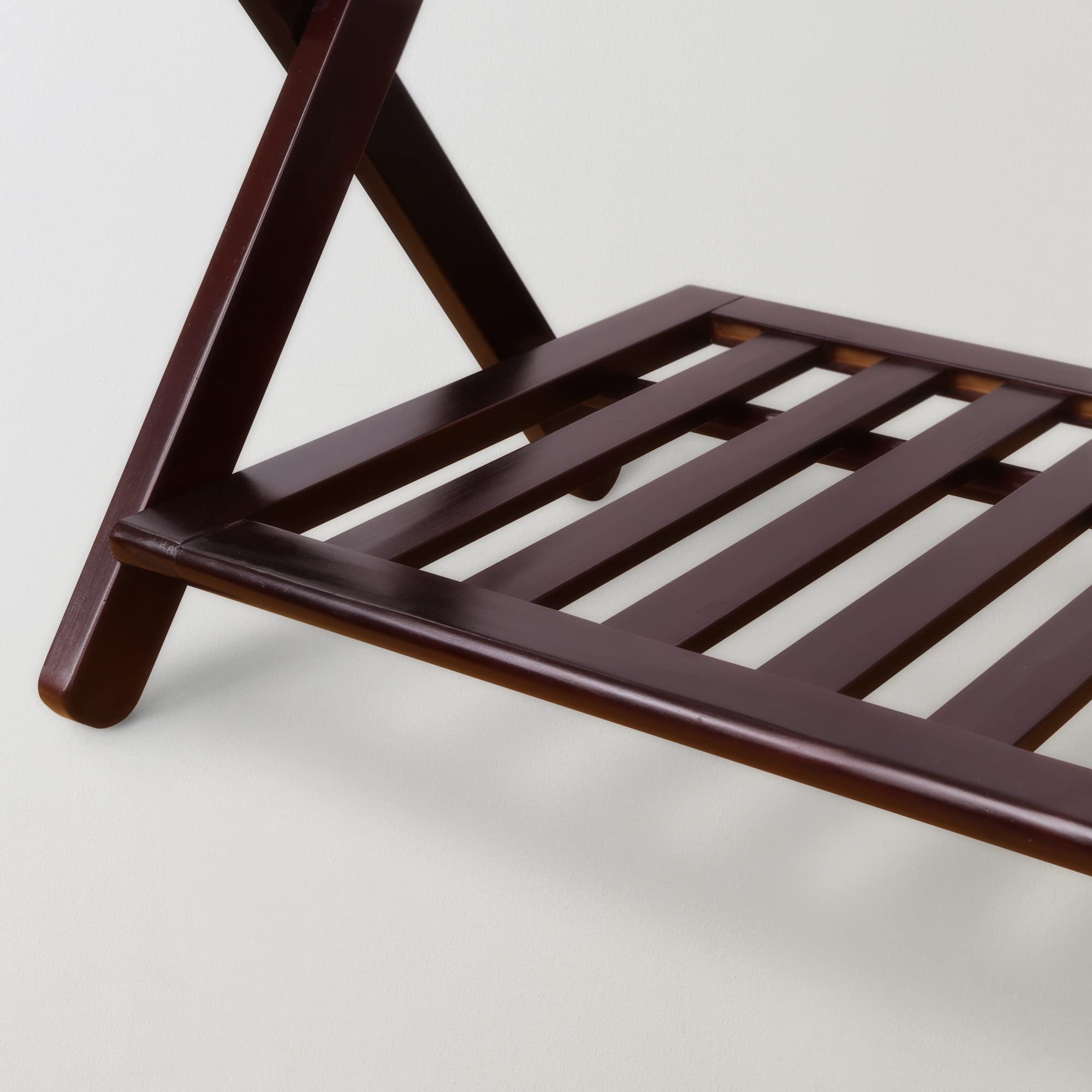 Casual Home luggage rack and shelf combo keeps belongings off the floor.