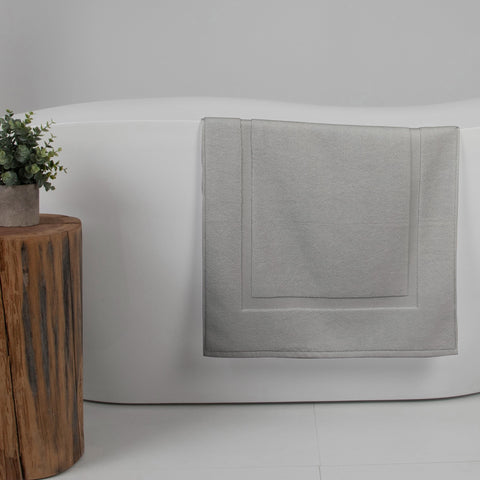 Casual Living grey cotton bath mat room ambience, complements towels and rugs.