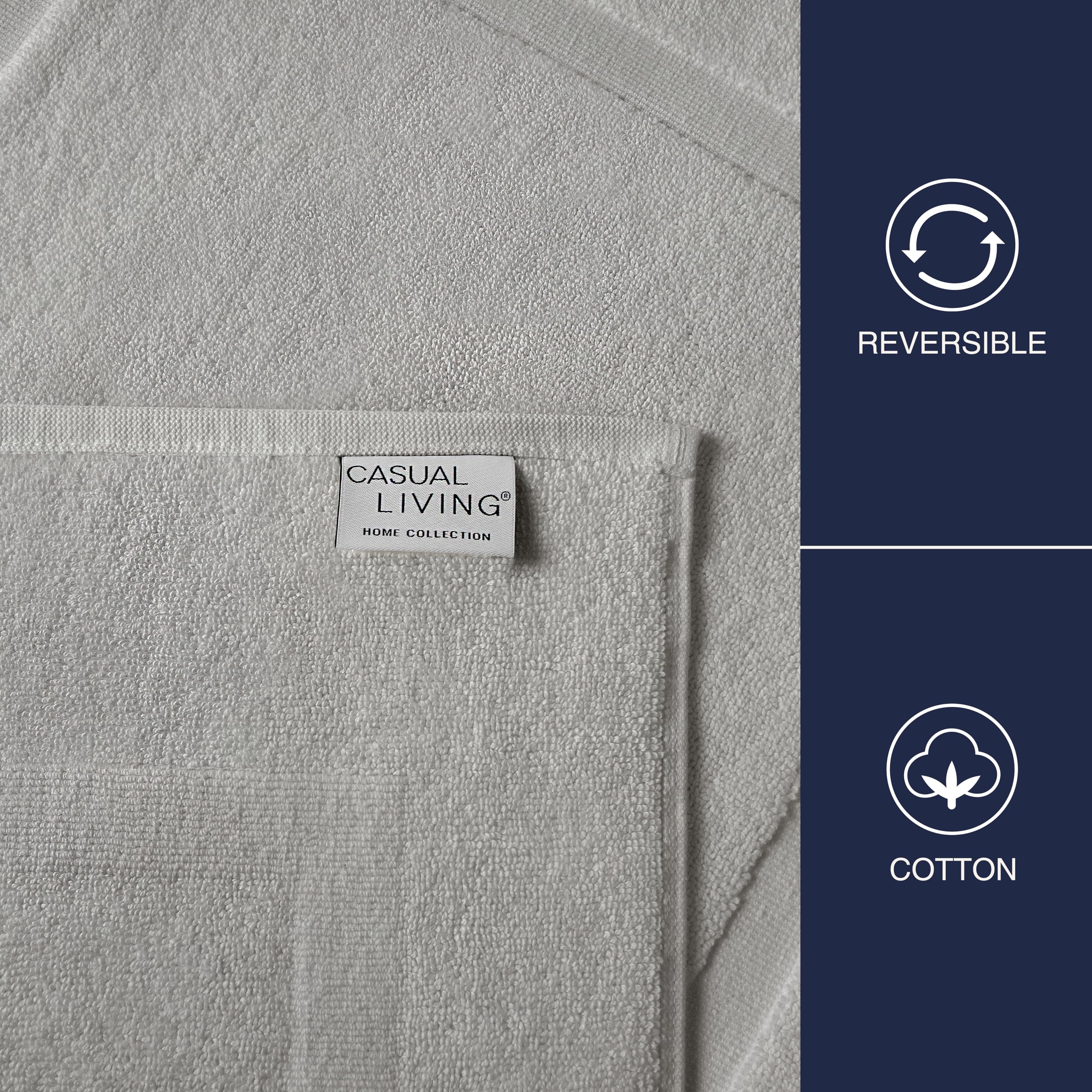 Casual Living grey cotton bath mat by sink, absorbs water and dries quickly.
