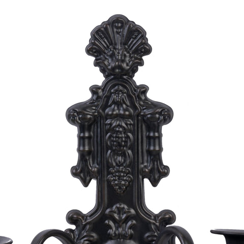 CC Wonderland Zone wall sconces on an outdoor entry with weathered black iron.