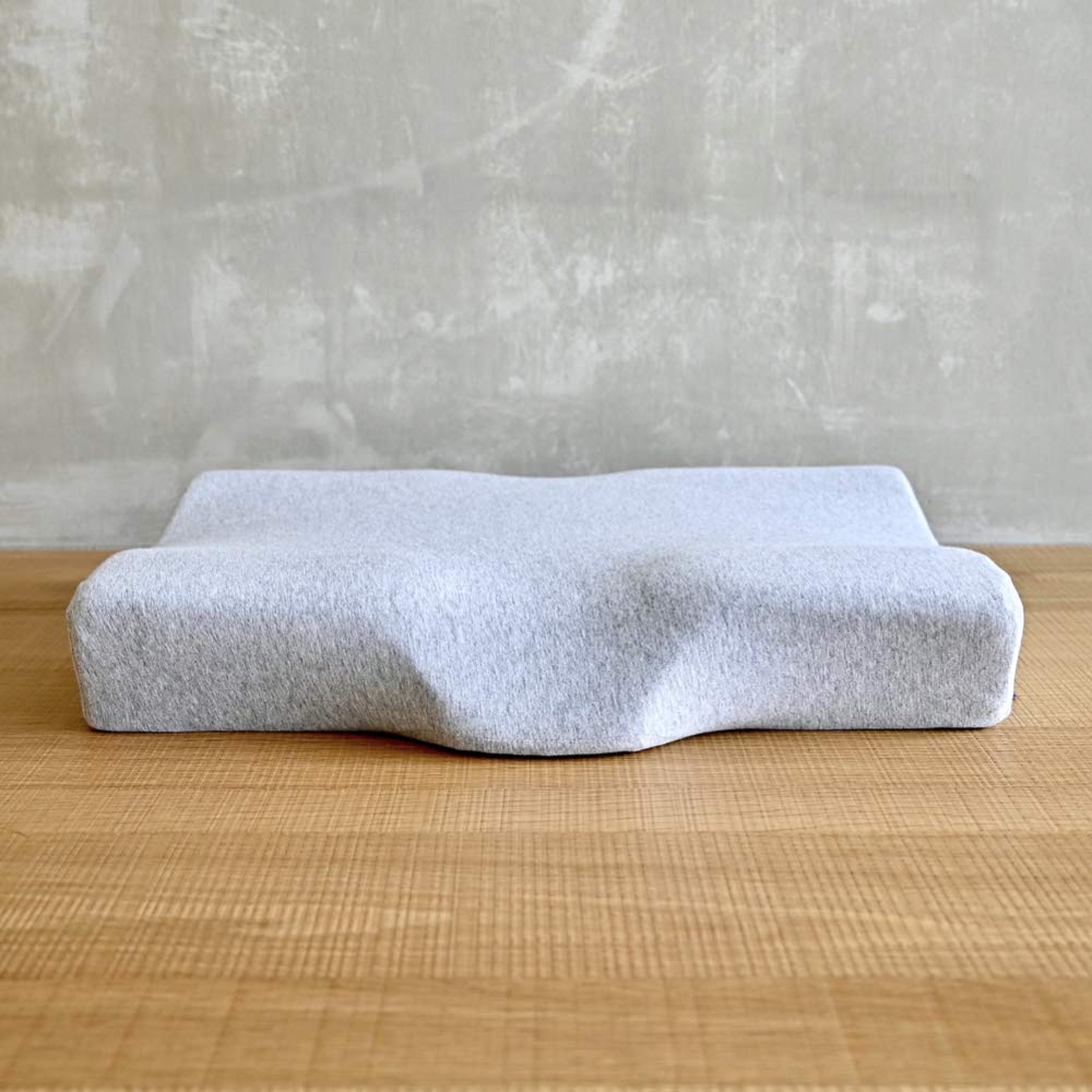 C CUSHION LAB extra dense cervical pillow side view showing ergonomic contour for side sleepers.