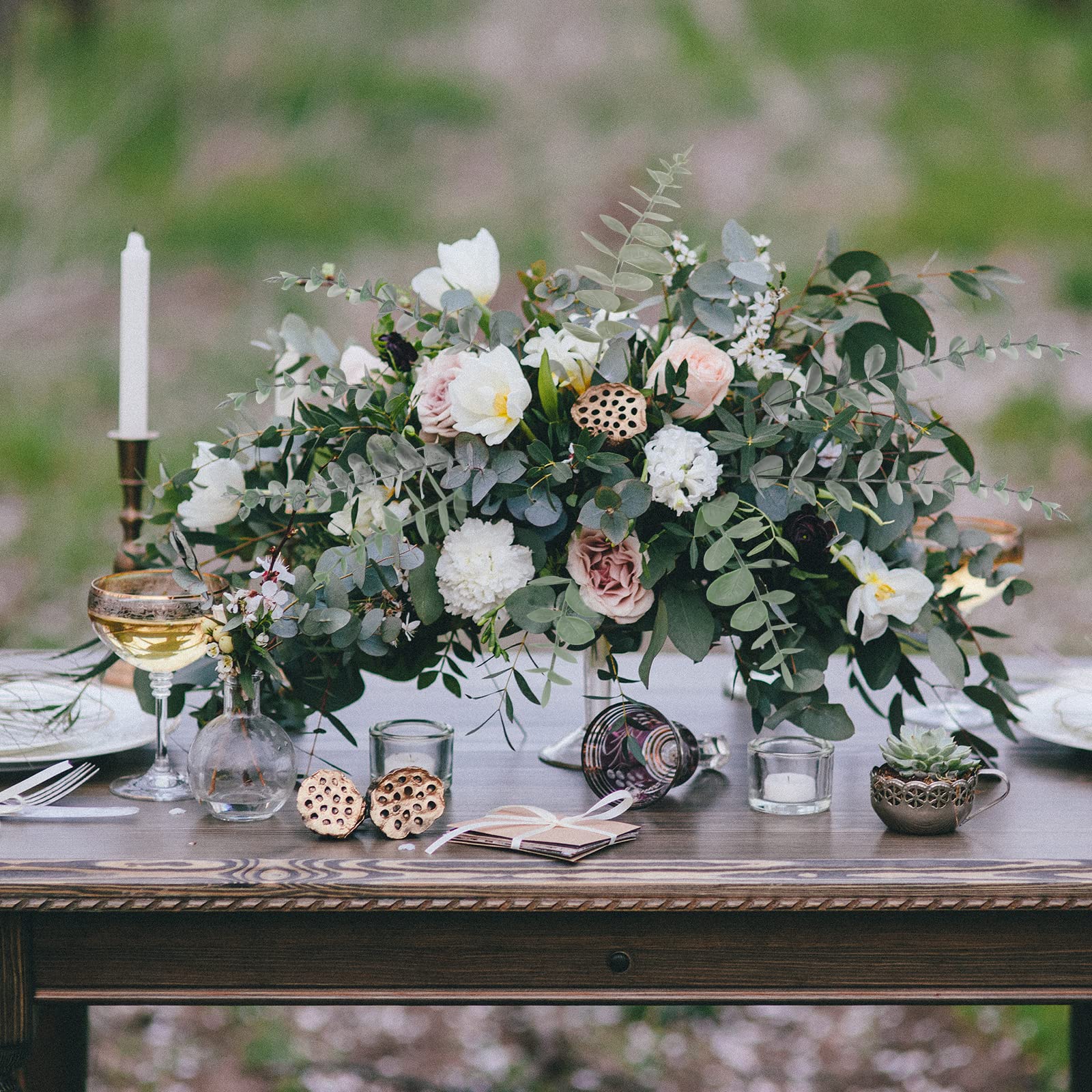 CEWOR eucalyptus stems used in a wedding centerpiece setup