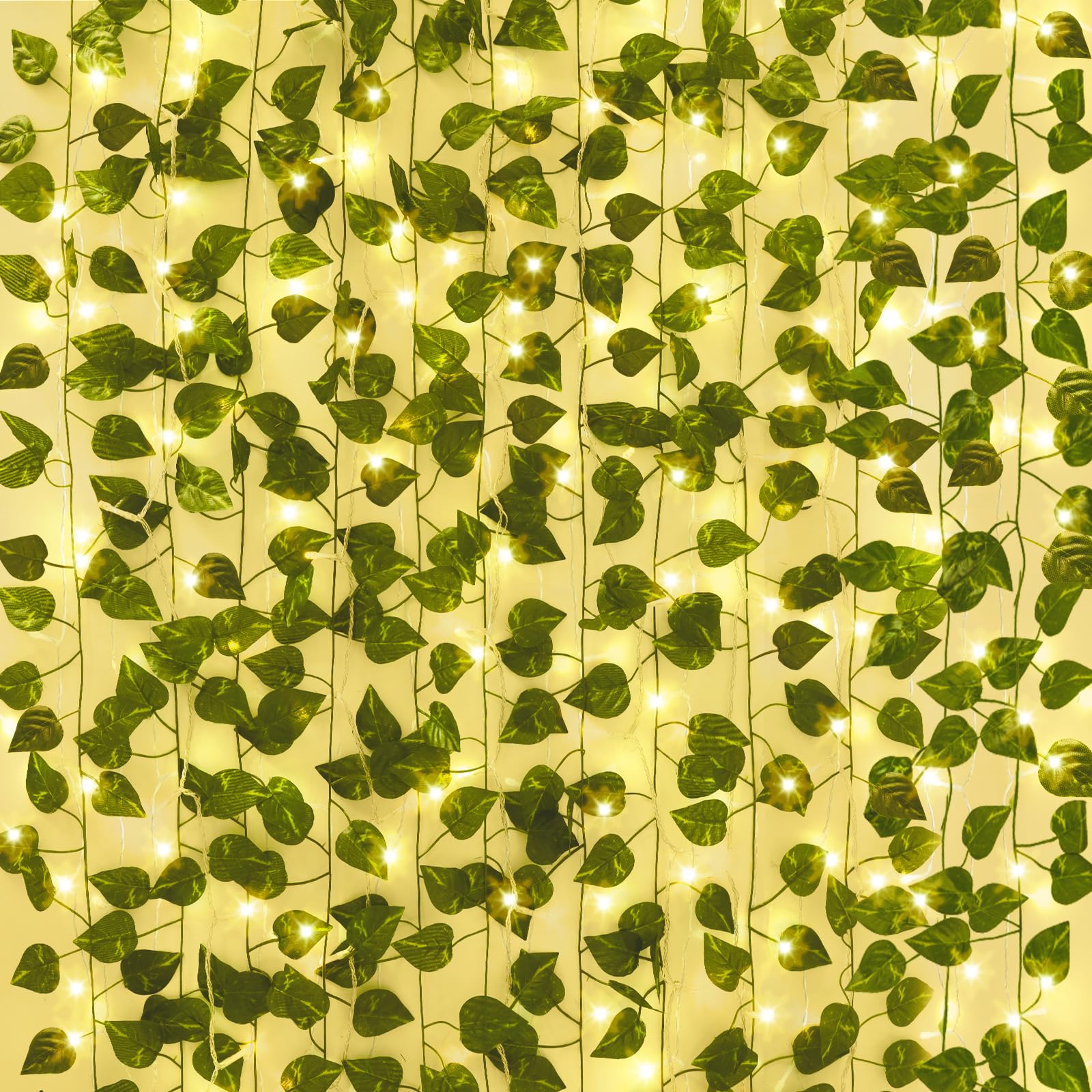 CEWOR ivy vines with lights hung on a wall for a warm room backdrop