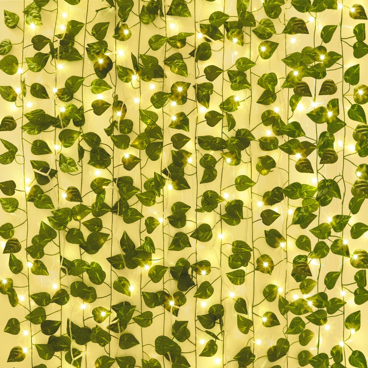 CEWOR ivy vines with lights hung on a wall for a warm room backdrop