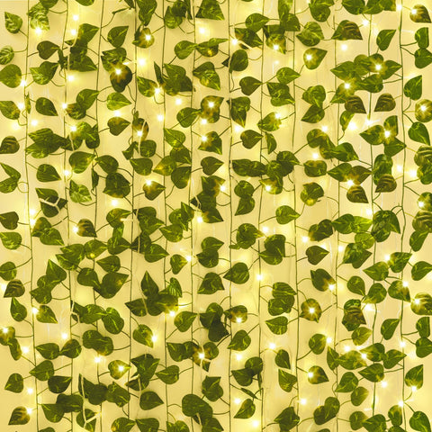 CEWOR ivy vines with lights hung on a wall for a warm room backdrop