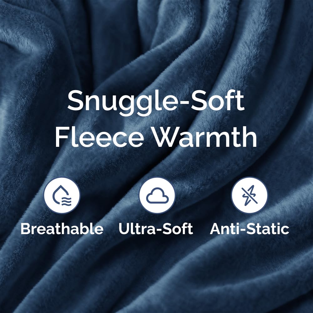 CGK Unlimited all-season blanket on couch demonstrates breathable warmth for year-round comfort.