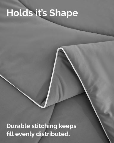 Bed setup showing CGK Unlimited comforter suited for dorm or travel