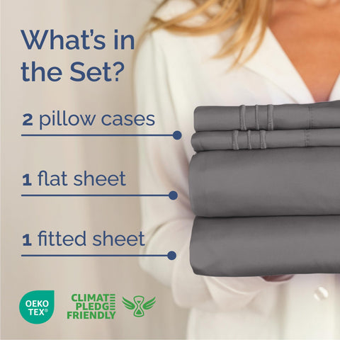 CGK Unlimited Cal King sheet set neatly folded on bed displays full flat and fitted sizes.