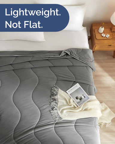 CGK Unlimited cooling comforter on bed with pillows, ideal for naps or reading.