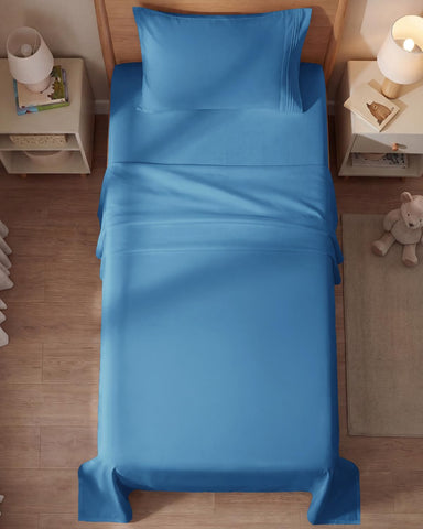 CGK Unlimited hotel-luxury vibe in a modern denim blue bedroom.