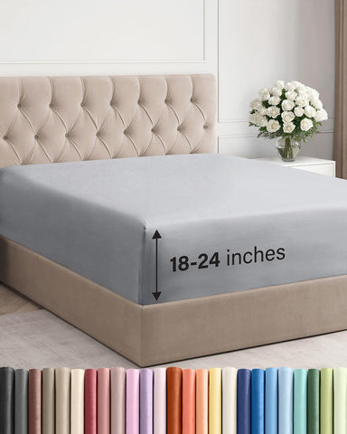 CGK Unlimited extra deep pocket Cal King fitted sheet on bed offers secure fit.