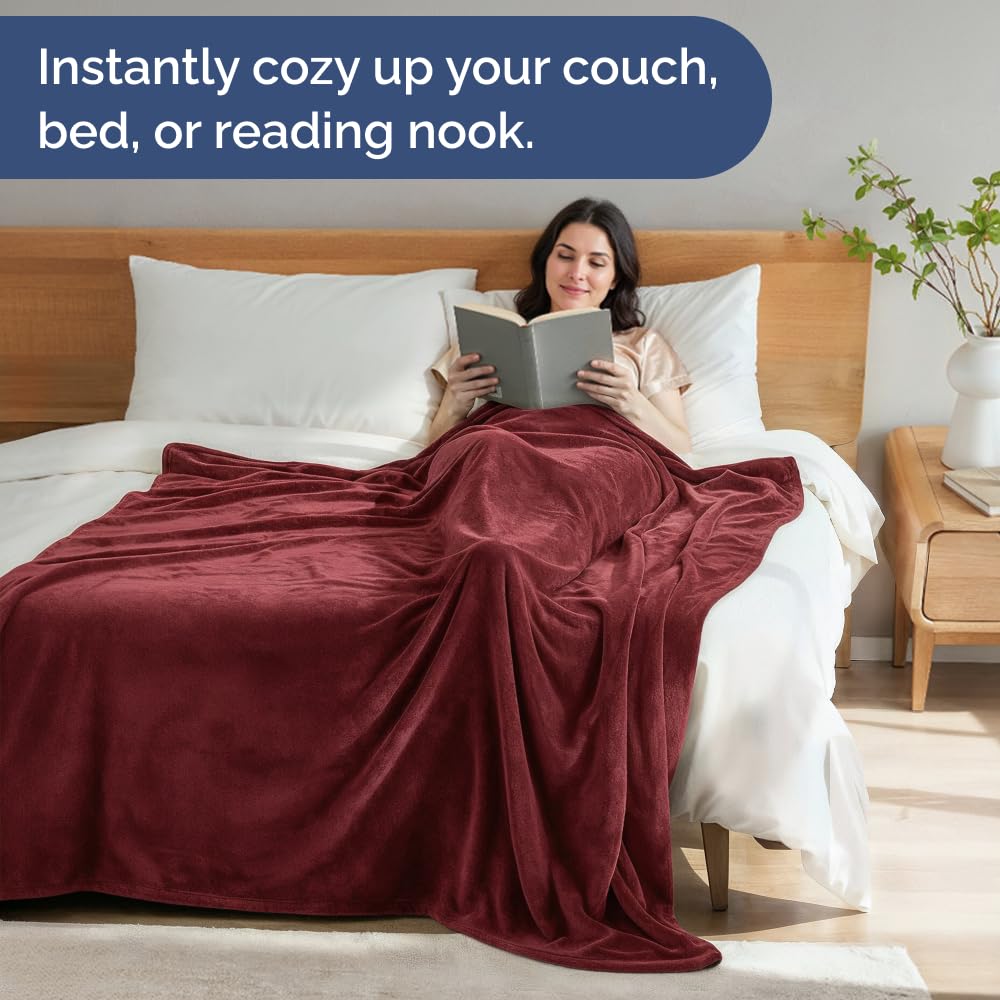CGK Unlimited fleece blanket draped over sofa for cozy warmth