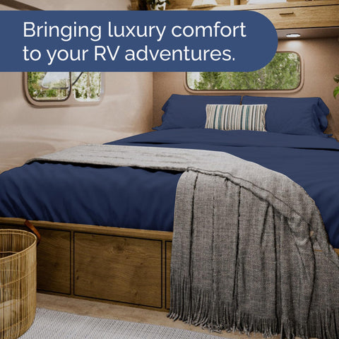 Navy blue CGK Unlimited RV sheet set in a chic bedroom setup