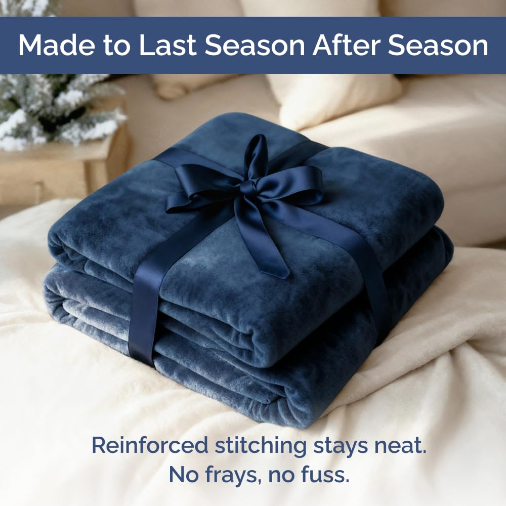 CGK Unlimited navy blanket complements bedrooms with a calm, modern vibe.