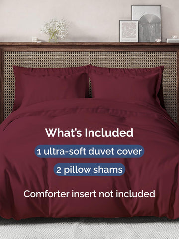CGK Unlimited burgundy pillow shams closeup highlighting secure ties and zipper closure.