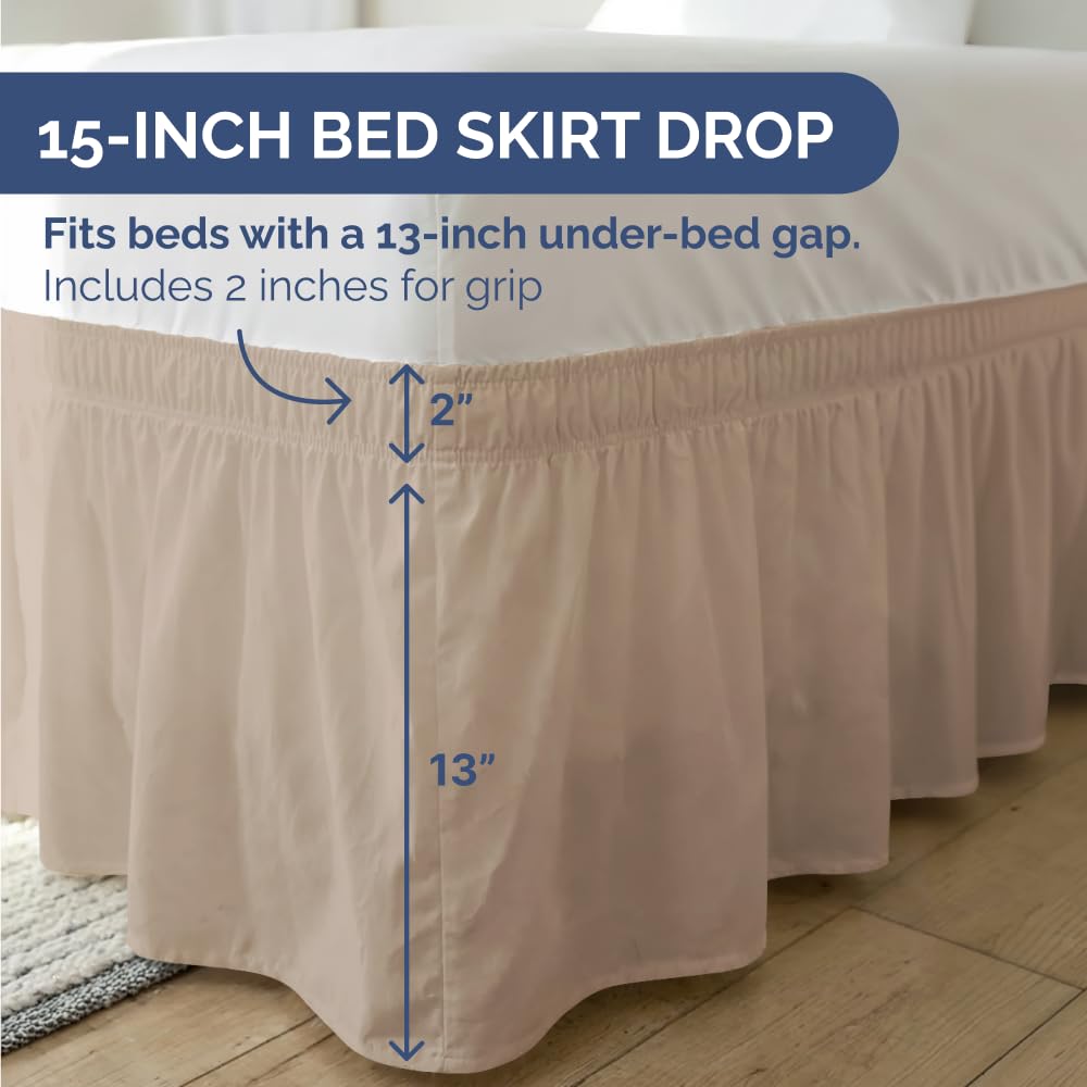 Cream pleated CGK Unlimited bed skirt draped to create a polished look