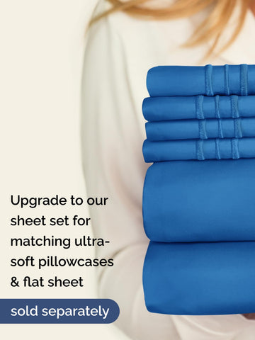CGK Unlimited royal blue king fitted sheet bed setup shows a tidy inviting surface