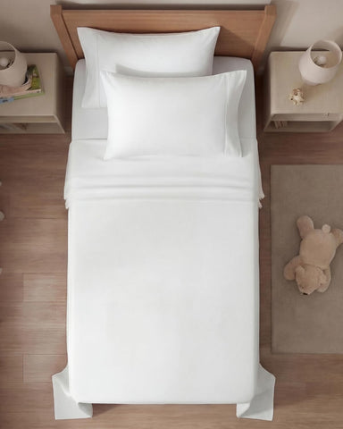 CGK Unlimited wrinkle-free bedding on bed for easy care